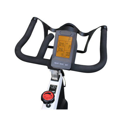 Handlebar-mounted monitor on the Wolfram Fitness Arctic Spin Bike displaying speed, distance and calories burnt for real-time home workout tracking