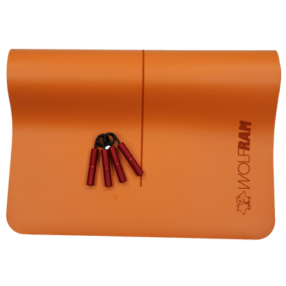 Wolfram Fitness orange yoga mat with two red heavy-resistance hand grips ideal for advanced forearm and grip strength exercises