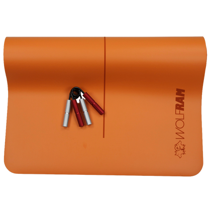 Orange Wolfram Fitness yoga mat showing one red and one silver hand grip, demonstrating different resistance levels for grip strengthening