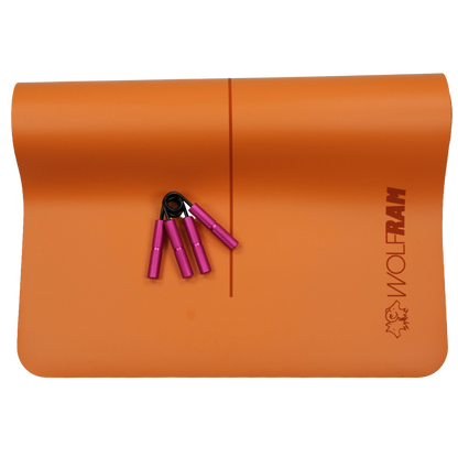 Wolfram Fitness orange yoga mat laid out with two pink hand grips in 45kg and 68kg resistance levels, showcasing premium grip trainers for forearm, finger and hand strength.