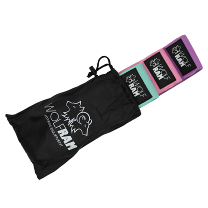 Wolfram Fitness 3-piece knitted booty bands partially tucked into the top of the carry bag, showcasing light, medium, and heavy resistance levels.